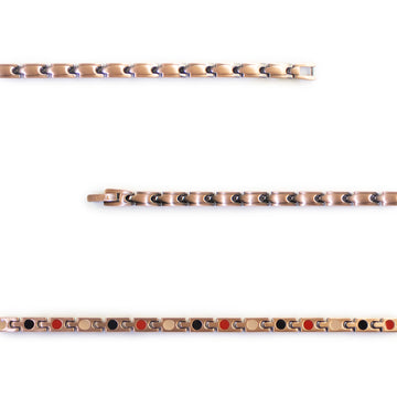 Close-up of Russet copper bracelet showing polished puzzle-like links.